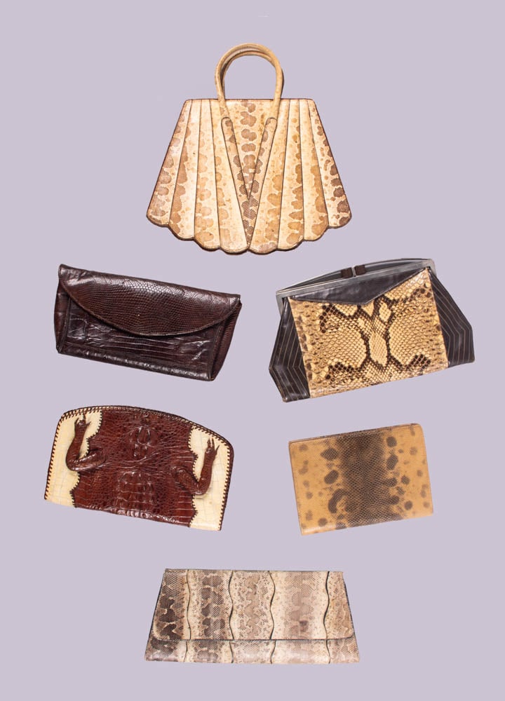 SIX REPTILE CLUTCHES, WALLETS OR PURSES, 1950s: 1 brown reptile wallet w/ moire lining, 7”x5”, Excellent; 1 brown & white alligator purse w/ leather lining, 9.5”x6”, (few missing fingers, mirror tarnish, few loose stitches i