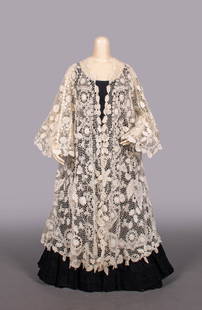 FINE IRISH CROCHET LACE COAT, 1905-1910: Irish crochet lace coat w/ embroidered fillet insertions & 3-D roses, bell sleeves, free front, B 60”, L 48”, (slip N/I, few tiny-1” light stains, few broken brides) Excellent.
