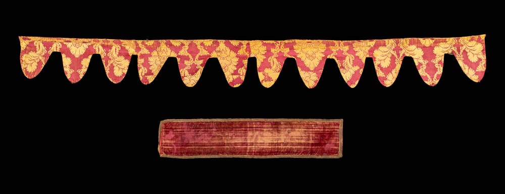 ONE PATTERNED SILK VALANCE & ONE VELVET RUNNER, EUROPE, 18TH C: 1 red & gold leaf patterned silk dagged valance lined w/ waxed linen, Italy, 18th C, 8.25” x 78.5”, (light 0.5”-5” staining, few 0.25”-0.75” holes, heavy wear, area