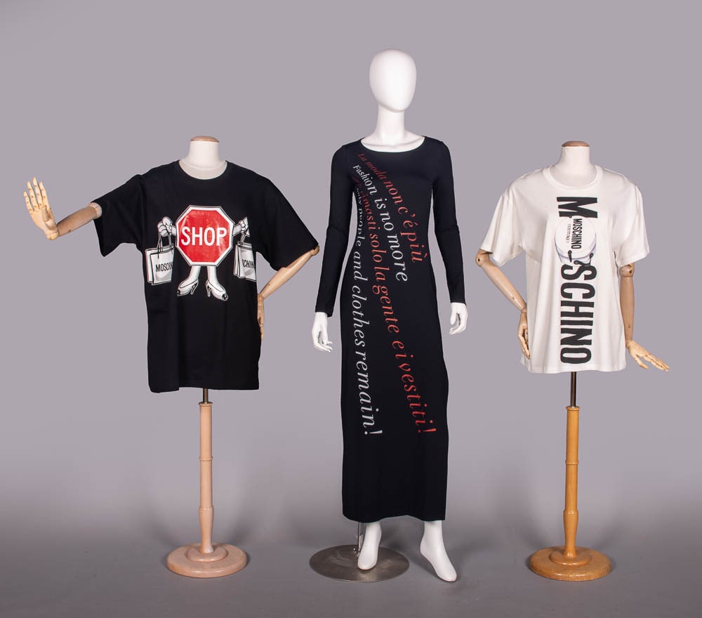 MOSCHINO FASHION IS NO MORE DRESS & GRAPHIC TEES, ITALY, 2000s: 1 deadstock black stopsign motif cotton t-shirt w/ original tags, label “Moschino Couture!”, B 48”, L 32, excellent; 1 black stretch maxi dress printed w/ “fashion is no more…”