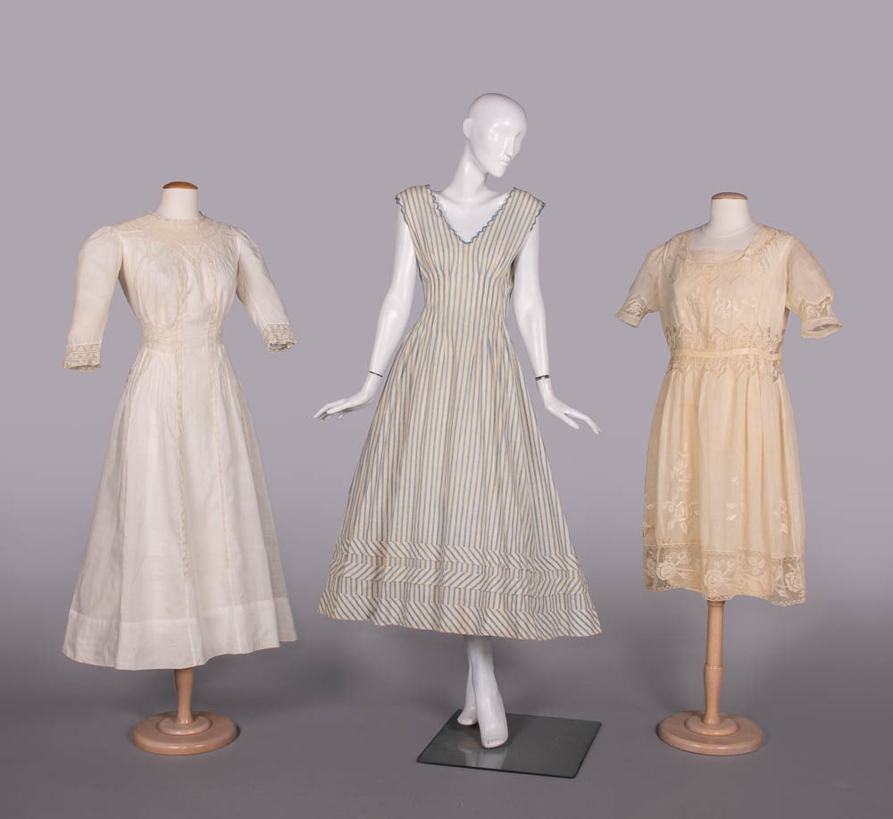 THREE COTTON OR LINEN DAY DRESSES, 1910-1920: 1 white handkerchief linen dress w/ elbow length sleeves, mm lace insertions & pintucks, c. 1910, B 34", W 24", L 48", (moderate discoloration CB bodice, 0.25"-0.5" light stains, few sm breaks/holes i