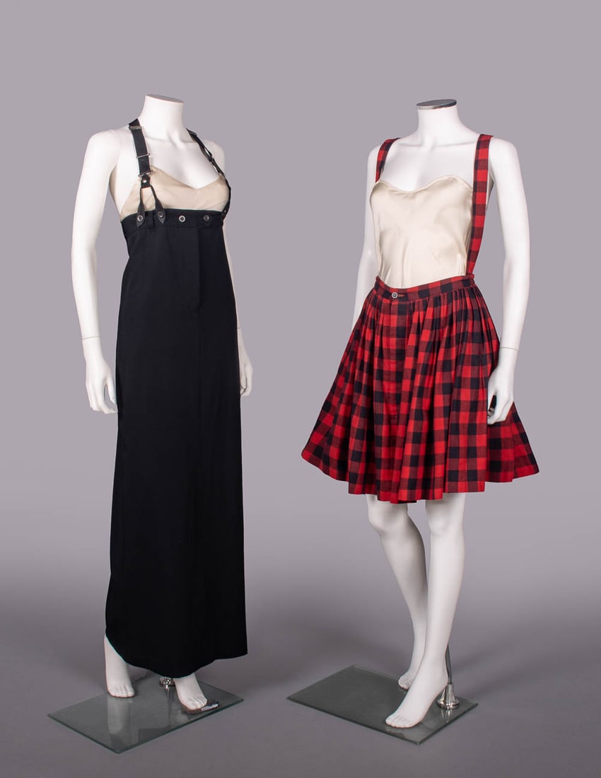 JEAN PAUL GAULTIER & NORMA KAMALI SUSPENDER SKIRTS, S/S 1993 & 1980s: 1 tuxedo style suspender skirt w/ fly front, partially lined w/ mans shirting, S/S 1993, label "Jean Paul Gaultier Femme", Wband 36", W-hem 46", (suspender elastic dry, tarnish to hardware, few 0.25"-
