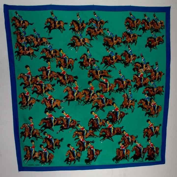 HERMES SILK SCARF, 1970-1980s: Calvary print, soldiers on brown horses gallop across emerald green field, printed "Hermes Paris", illegibly signed by artist-designer, 34" x 35", excellent. Provenance: Mme. Erna de Paz, Argentine & 