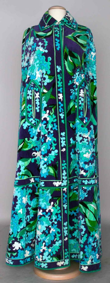 PUCCI VELVET PRINT BEACH CAPE, c. 1970: Velvet on outside, terry cloth inside, purple, blue & green stylized floral print, 2 slits for arms, label "Emilio Pucci Florence Italy", B 34", L 56", excellent.Mme. Erna de Paz, Argentine & Parisien
