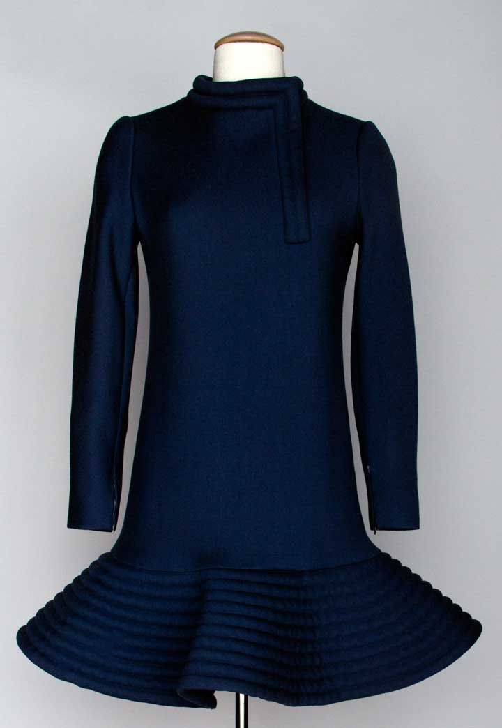 PIERRE CARDIN WOOL DAY DRESS, c. 1969: Blue-gray wool, rouleau collar & trim, channel quilted drop waist skirt, unlabeled, B 34", W 38", L 34", (weak zipper teeth) excellent. Purchased at Pierre Cardin in Paris. Mme. Erna de Paz, Argentine
