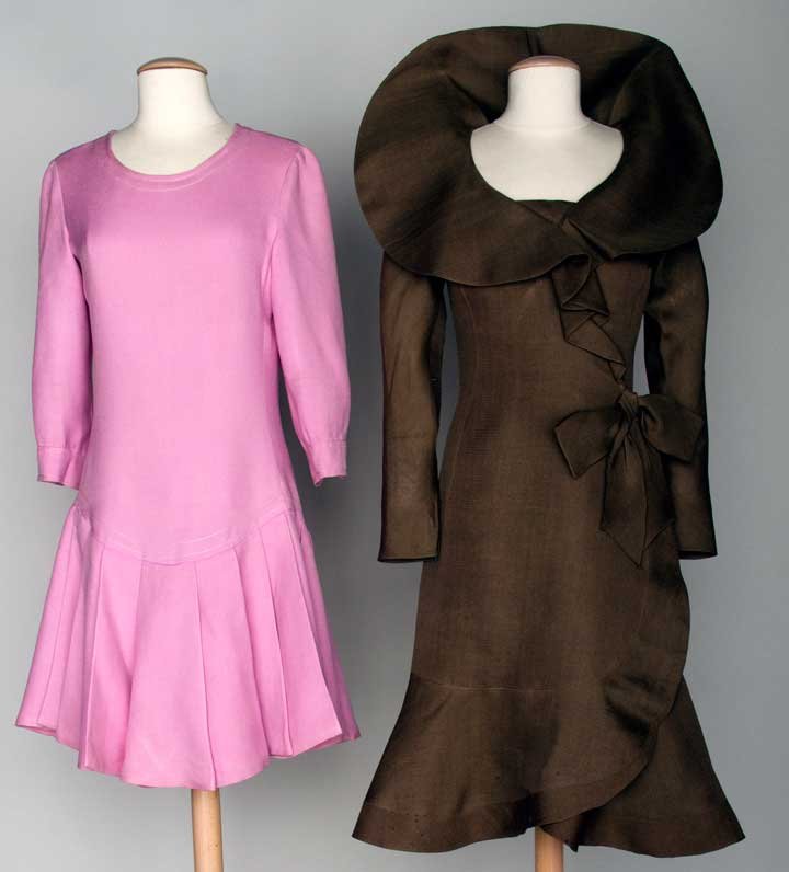 TWO PIERRE CARDIN DRESSES, 1970-1974: Both linen & unlabeled: 1 cocoa brown, stand up collar, side ruffle & bow, B 34", H 40", L 37", (alterations: all seams let out, large gore inserted in both sleeves, armscye not resewn evenly) fair; 1
