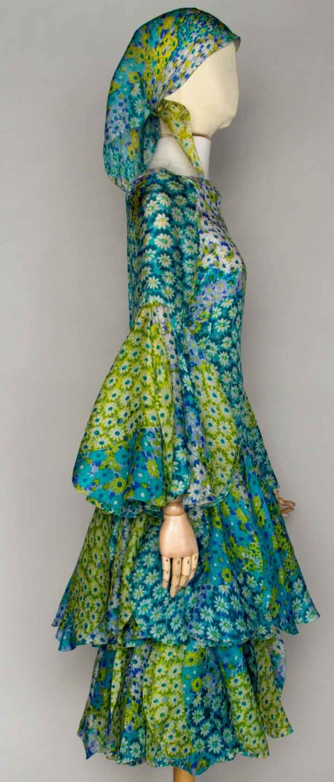 PIERRE CARDIN COUTURE PETAL DRESS, PARIS, 1970s: Silk organdy w/ small blossom print in turquoise, lime, white, & purple, square ballet neckline, long sleeves, 2 tiers of petal shaped panels below hips & on sleeves, matching neck scarf, bouquet of s