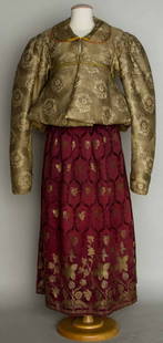 TWO WOMEN'S GARMENTS, RUSSIA, MID 19TH C: 1 metallic brocade heavily padded jacket w/ peplum, B 33", L 21"; 1 burgundy & metallic gold brocade silk skirt, L 37"; t/w 1 padded peplum from Russian jacket, very good.