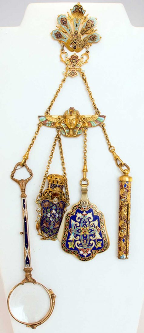 ENAMELED GOLD CHATELAINE, 1850-1890: Blue & red enameled clasp over winged pharoah element, 4 chains holding magnifying glasses, perfume vial, notecard & pencil, (clasp changed to pin, pencil missing interior works, made of elements from