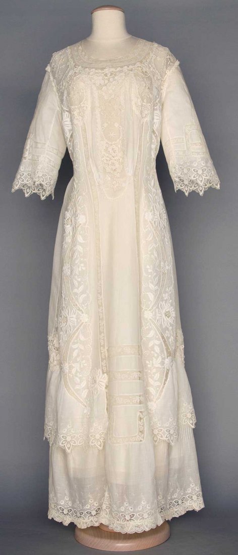 WHITE LACE TEA GOWN, c. 1910: 1-piece cotton lawn w/ embroidery, filet lace, Val lace & Irish crochet, B 36", W 29", L 57", (few tiny pin holes in lawn, several holes in lace) very good.