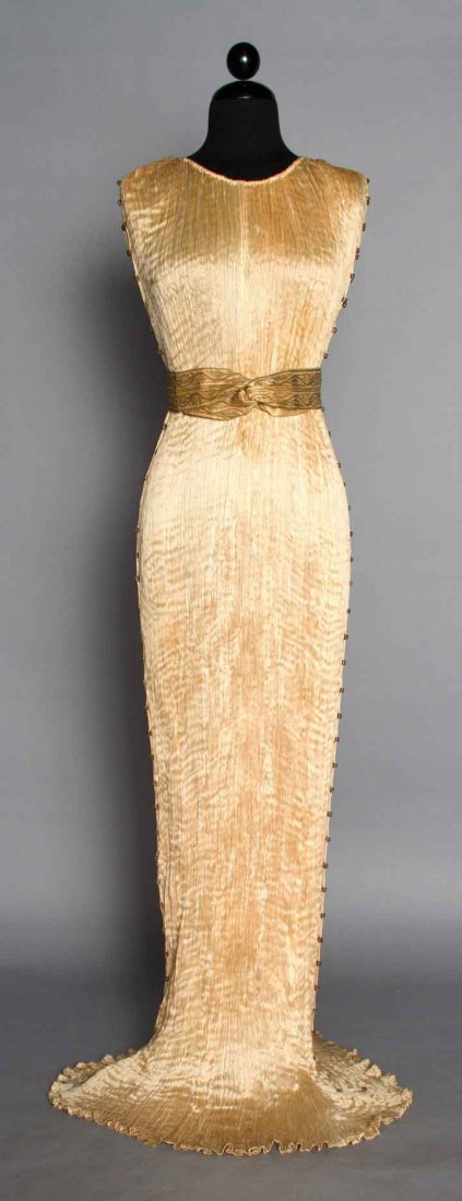FORTUNY SILK DELPHOS W/ BOX, 1920-1930s: Blond silk pleated sleeveless gown, Murano amber & white glass side seam beads, stencilled cotton sateen 2" belt, dress & belt labeled, L 59", (hem edge dingy & few tiny spots) pleats all tight, excel