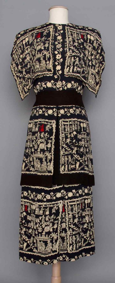 ADRIAN SILK PRINT AFTERNOON DRESS, 1940s: 2-piece, midnight blue silk crepe w/ print of various indigenous people & animals, long peplum top w/ short sleeves & front capelet, slim skirt w/ CF kick pleat, labeled, B 36", W 26.5", Top L 33", Sk