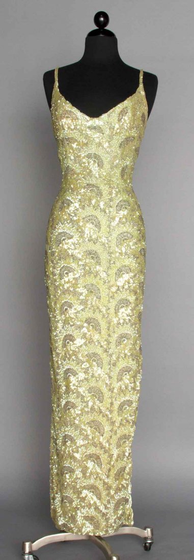 BEADED EVENING GOWN, FRANCE, 1950s: Fitted sheath covered in celery green sequins & silver beads in open fan pattern, sleeveless boned bodice, V-neck, low-cut back, deep side slit, pale green faille lining, labeled "Jacqueline Paris Han