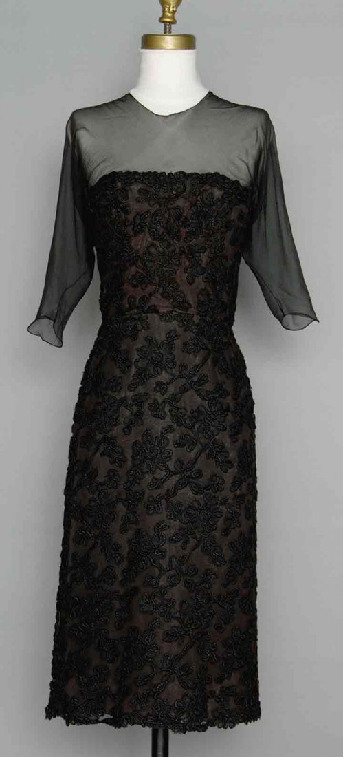 BALENCIAGA COUTURE COCKTAIL DRESS, 1950s: Black lace over silk chiffon, strapless w/ chiffon upper bodice panel extends to back as 2 streamers, labeled "Balenciaga", inner tape inked "50097", B 30", W 23", H 34", L from Sh 40", (bust lining t