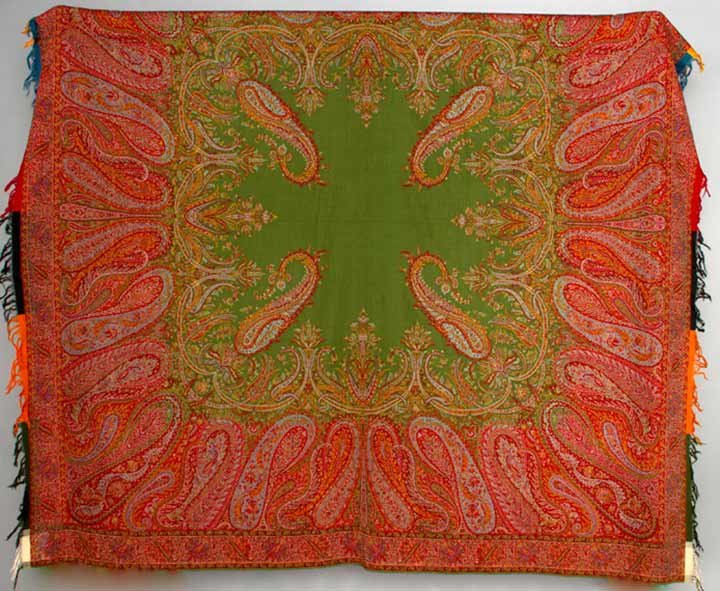 WOOL PAISLEY SHAWL, 1860-1880s: Machine woven, dark green center, elongated boteh border in pinks, blues, red & gold, narrow floral frame, 2 fringed ends w/ solid colored gates, 72" x 73", (few very small weak spots) excellent. Prov