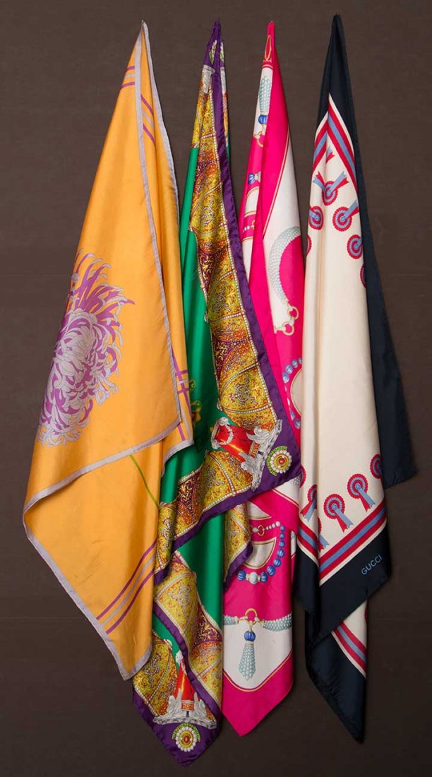 FOUR SIGNED DESIGNER SCARVES, 1950-1970: All silk twill & signed w/ designers' name: 1 Gianni Versace emerald green ground filled w/ jeweled crosses & elaborate border of domes in gold, purple & red, 33.5" x 34.5", excellent; 1 Cartier white