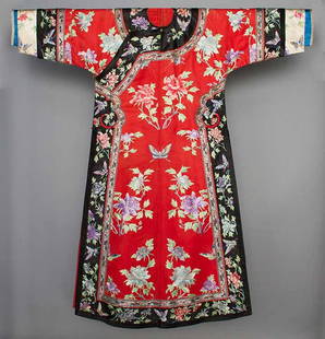 LADY'S EMBROIDERED ROBE, CHINA, 1900-1920: Red silk, peony & butterfly embroidery, embroidered black satin trim, side closure w/ brass ball buttons, Slv-Slv 51", Ch 44", L 53", (loose stitches, sleeves shortened by folding and tacking, not