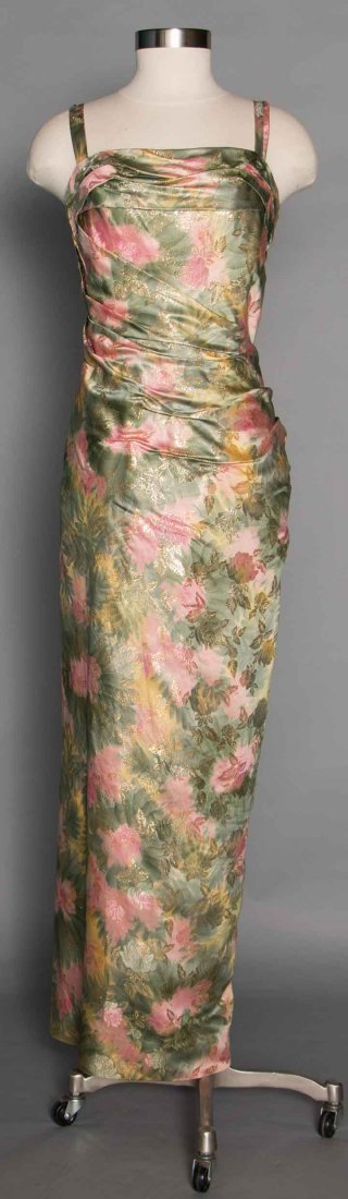 CEIL CHAPMAN PRINTED & LAME GOWN, 1950s: Silk satin w/ painterly print in sage green, pale yellow & pink, rose patterned gold lame brocade, sheath gown ruched from neckline to hip area & caught in pleats at CB zipper, narrow shoulder straps,