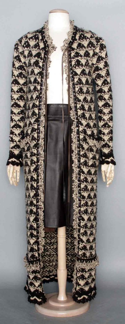 CHANEL SM SZ SWEATER COAT, 2000s: Full length wool or wool & cashmere blend, knit in beige & dark brown triangle patterns, 2 patch pockets, open front, leather drawstring at neck, crochet & leather trim at round neckline, cuffs, pocke