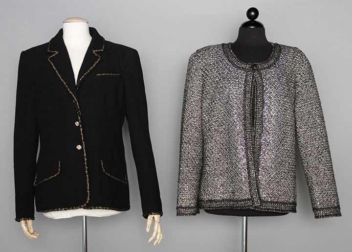 TWO CHANEL LG SZ JACKETS, 2000s: Both labeled & marked French Size 48 (US 14): 1 black wool blend boucle w/ gold yarn trim, logo buttons w/ design of gold lion, chain hem weight, L 27"; 1 cashmere blend black & white knit sweater, ro