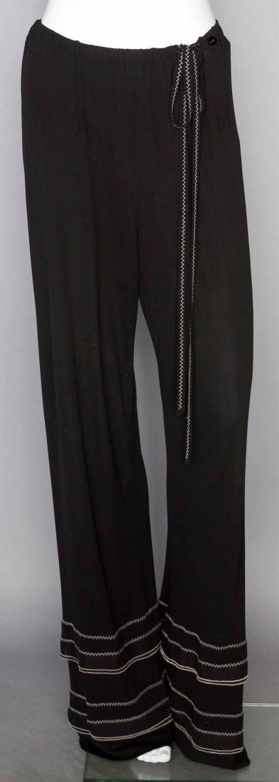 PAIR OF CHANEL EVENING PANTS, c. 2000: Viscose jersey, labeled, tie belt, double flounces at bottom of legs trimmed w/ white feather stitching, FR size 42 (US 8), unworn, pristine. Estate of Karen Kendle Marshe, director of footwear for CH