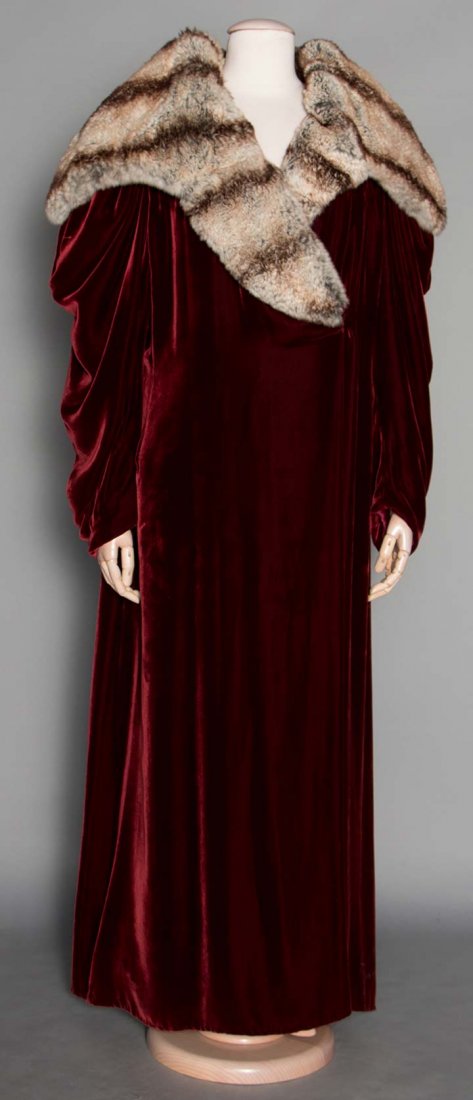 BURGUNDY VELVET EVENING COAT, 1930s: Silk velvet, gathered long sleeves, oversized chinchilla fur collar, label "Bonwit Teller Fifth Avenue New York" silk satin lining, Sh-Sh 15", L 56", (3" x 1" area on back velvet pile is pressed) exce