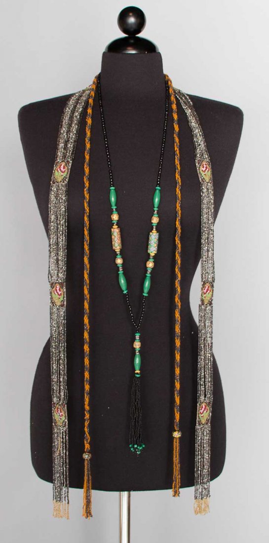 THREE BEADED NECKLACES, 1920s: 1 gunmetal & gold glass bead braided rope, end tassels w/ Italian glass beads, L 55" plus 3.5" each tassel; 1 black & green bead interspersed w/ crystal & gold Italian beads & 2 multicolor trade beads