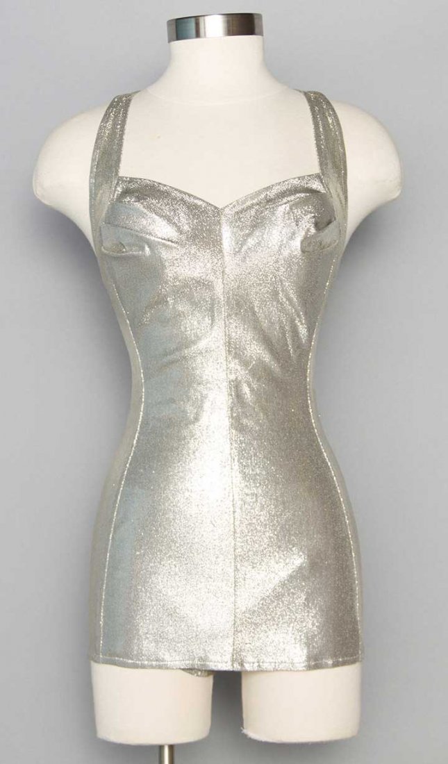 COLE OF CA. SILVER LAME SWIMSUIT, 1950s: 1-piece, sweetheart neckline, short skirt over panties, low U-cut back w/ criss-crossing straps, built-in bra, labeled & marked Size 14, B 38", L 27", excellent.