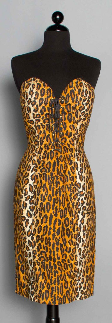 PATRICK KELLY COCKTAIL DRESS, PARIS, 1989: Leopard print cotton, strapless, CF corset lacing, labeled "Patrick Kelly Paris", B 34"-36", W 27", H 38", L 33", excellent. Identical dress in Philadelphia Museum of Art's 2014 exhibition "Patrick Ke