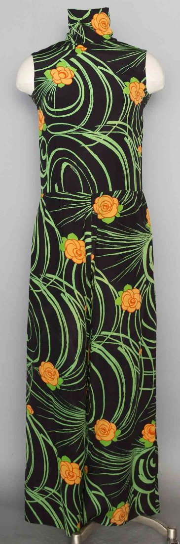 RUDI GERNREICH SILK JUMPSUIT, 1970s: Black silk crepe w/ apricot blossom & green foliage print, labeled, high funnel neck, sleeveless, 2 side pants pockets, black silk lining, B 34", W 30", Inseam 29", (stains, 1 of 8 buttons on neck mis