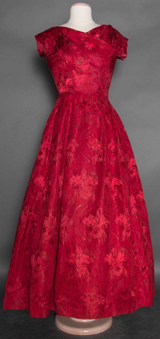DIOR RED BALL GOWN, LONDON, 1950s: Red satin & gold lame brocade in orchid pattern, cap sleeve, boned red tulle corset & 2 attached pettycoats, Label "Christian Dior Made in England by CD Models London 08056" B 36", W 28", L 55", (tiny