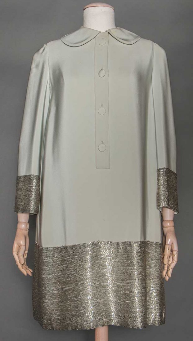 NORMAN NORELL BEADED EVENING DRESS, 1960s: Powder blue heavy silk, peter pan collar, hem & cuffs densly embroidered w/ rows of silver bugle beads, labeled "Norman Norell", white organdy backing, blue China silk slip, B 34", H 32", L 37", (coll