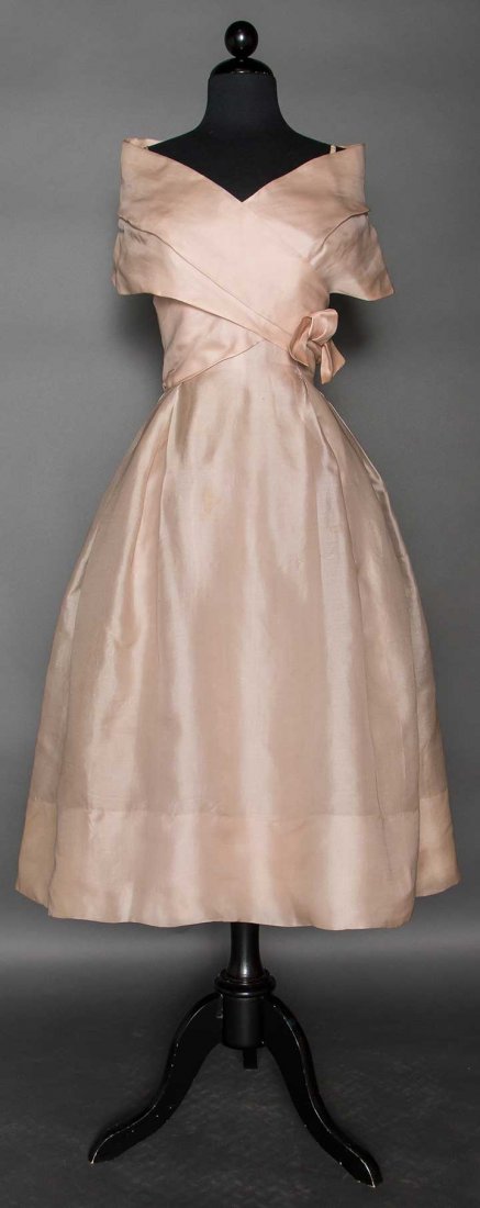 DIOR COUTURE EVENING DRESS, S-S 1957: Pale pink blush silk, full skirt, sleeveless, spaghetti straps under wide off the shoulder collar, CB bow, self fabric bodice lining, fitted cotton net corset, 3 attached pink crinolines, label "Print