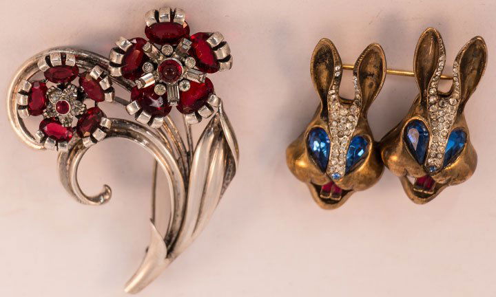 TWO STERLING BROCHES, 1940-1950s: Both signed: 1 "Coro" duet, 2 gold rabbit heads w/ rhinestones & red & blue stones, 1.75" x 2", (4 tiny rhinestones missing) very good; 1 "Pennino" floral tremblant w/ red stones & rhinestones, 2" x 3