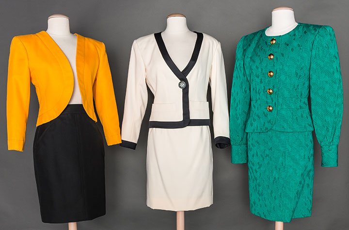 THREE SAINT LAURENT SKIRT SUITS, 1980s: All labeled & marked FR size 34: 1 emerald green cotton matelesse w/ gold dome buttons, excellent; 1 winter white wool w/ black trim & 1 jeweled button; 1 school bus yellow short open F jacket & black