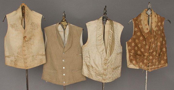 FOUR MEN'S VESTS, 1850-1890s: 1 brown stippled & floral print, fair; 1 white on white embroidery, fair; 1 ivory sprigged silk, very good, (all w/ stains or damage); 1 1890s tan linen, excellent. Kochan-Troiani collections.