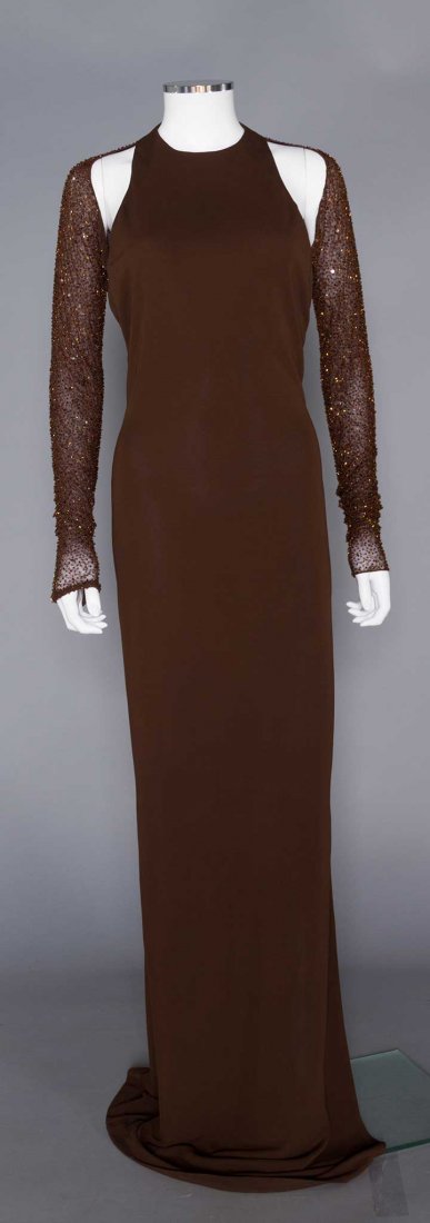 HALSTON BROWN JERSEY EVENING GOWN, 1970s: Synthetic knit, chiffon long sleeves studded w/ copper beads, exposed shoulders, extremely low U back, H to 40", L 68", marked size 8, (missing beads, especially to back) very good.