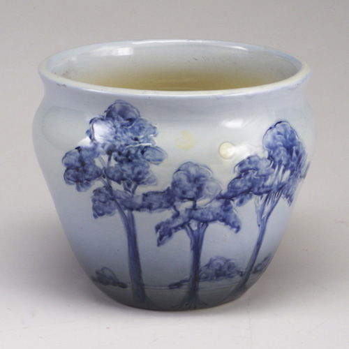 WELLER Jap Birdmal jardiniere with lands: WELLER Jap Birdmal jardiniere with landscape of indigo trees and full moon on a light blue ground. Abrasion to walls, clay deposit near base. Stamped WELLER. 8 1/2² x 10 1/4²