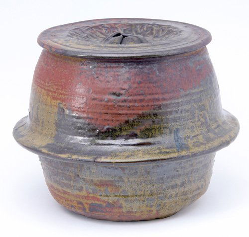 TOSHIKO TAKAEZU Stoneware sculptural garden stool: TOSHIKO TAKAEZU Stoneware sculptural garden stool covered in amber and mahogany matte glaze, complete with internal rattle. Hairlines run around half the upper portion. Incised initial. 11" x 13"