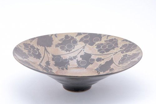 SUTTON TAYLOR Earthenware flaring center bowl deco: SUTTON TAYLOR Earthenware flaring center bowl decorated in a grapevine pattern in lustered brown and taupe glazes, 1986. (Provenance: The Collection of Kenneth L. Freed, Boston, MA). Chop mark. 4 1/4"