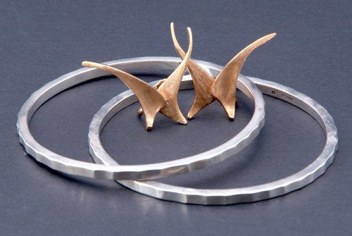 ED WIENER Biomorphic 14K yg earrings: ED WIENER Biomorphic 14K yg earrings in original box, ca. 1960, marked EW, 12.5 gs., 1 1/4" x 1 3/4"; also a pair of sterling bangles, marked conjoined CF.