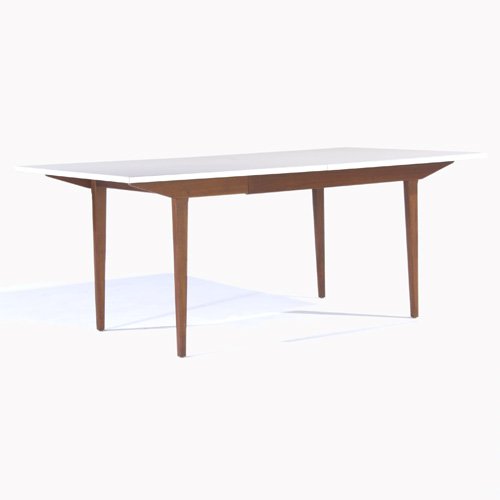 GEORGE NELSON / HERMAN MILLER Dining table: GEORGE NELSON / HERMAN MILLER Extension dining table with white laminate top and two 20" leaves. Herman Miller label. 30" x 72" x 40"