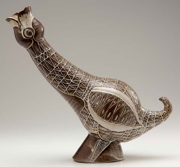 AARON BOHROD Bird-shaped pitcher with incised feat: AARON BOHROD Bird-shaped pitcher with incised feather pattern, covered in matte brown and white glaze. Signed ABohrod. 13" x 13"