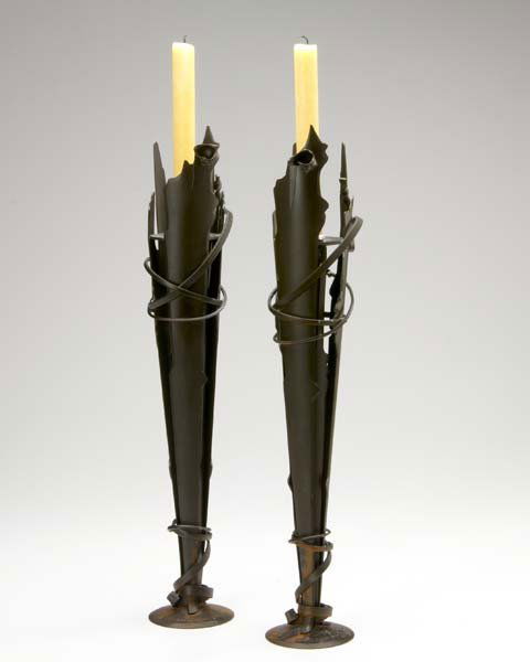 ALBERT PALEY Pair of Vulcan candleholders in forge: ALBERT PALEY Pair of Vulcan candleholders in forged and fabricated steel, 1994. Stamped ALBERT PALEY 1994 and numbered S-36 41 and S-36 26. 20 1/4" x 4"