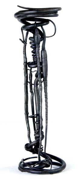 ALBERT PALEY Plant stand of forged and fabricated: ALBERT PALEY Plant stand of forged and fabricated steel with circular slate top, 1982. Stamped PALEY 1982. 53" x 16 1/2"