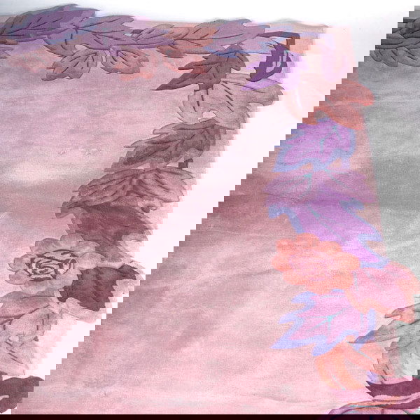 EDWARD FIELDS Room-size rug, 1991, with border of: EDWARD FIELDS Room-size rug, 1991, with border of flowers and leaves in shades of purple, blue, and brown against a mauve ground. Signed and dated on selvage. Approx. 140" x 146"