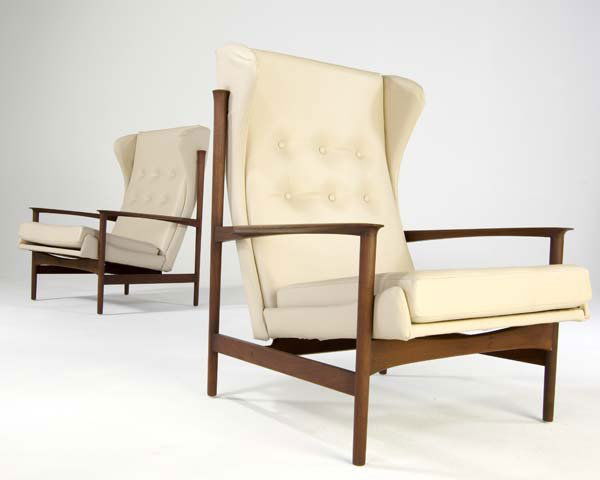 DANISH Pair of teak wing chairs upholstered in whi: DANISH Pair of teak wing chairs upholstered in white leather. Red metal tag, Made and Finished in Denmark, Imported by Selig. 40" x 34" x 29"