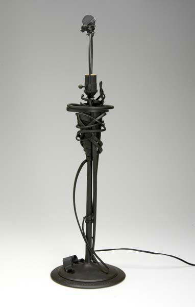 ALBERT PALEY Forged steel table lamp, 1993. Stampe: ALBERT PALEY Forged steel table lamp, 1993. Stamped Albert Paley 1993 with copyright, also marked C114 and numbered 11/25. 30" x 9" dia.