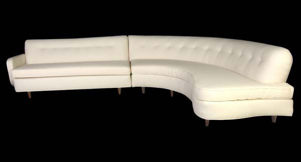 GILBERT ROHDE Two-piece sectional sofa with single: GILBERT ROHDE Two-piece sectional sofa with single arm and tufted white fabric upholstery on tapering wood legs. 30" x 90 1/2" x 34 1/2" and 30" x 66 1/2" x 33"