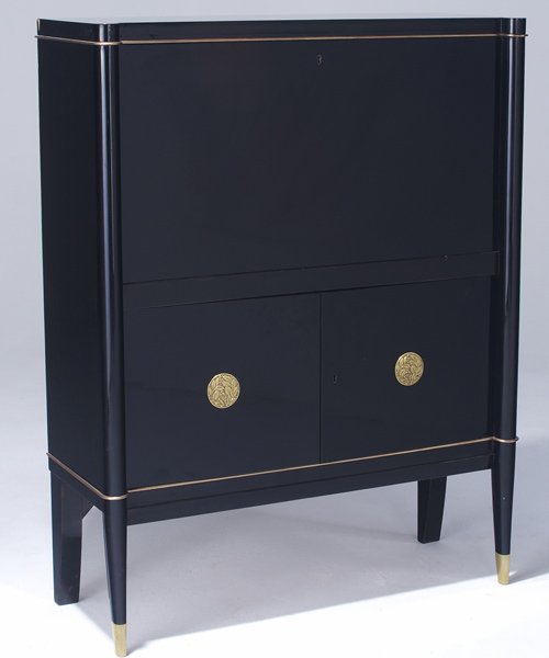 DE COENE (Belgium) Fall-front desk with black lacq: DE COENE (Belgium) Fall-front desk with black lacquer finish, brass trim, and embossed brass medallions, c. 1940. 51 1/4" x 39 3/4" x 15"